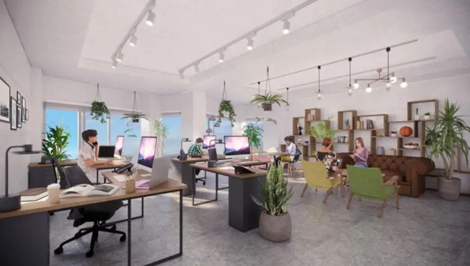 モダンで開放感のあるオフィススペース、明るい光の中で作業する人々とリラックスエリア、植物とアートが飾られたインテリア