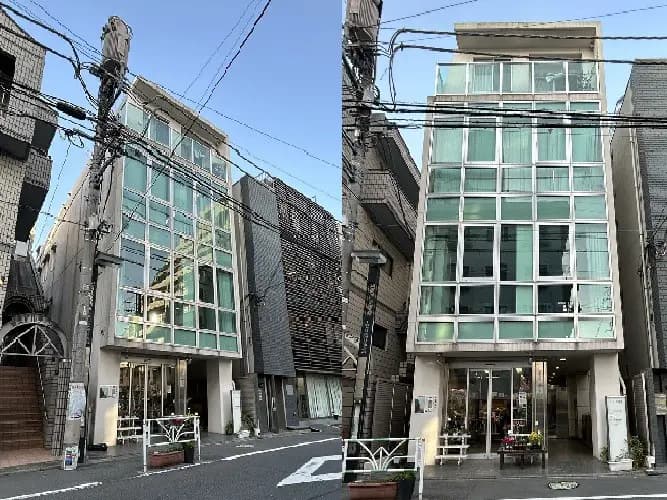 - 近代的なガラス張りの建物の外観、周囲には他の商業ビルが立ち並び、道路に面している様子