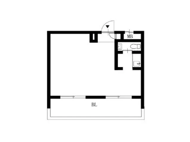 日本の都市部にある煉瓦造りのアパート外観、日差しが差し込む角地、地上に自転車駐輪スペースあり