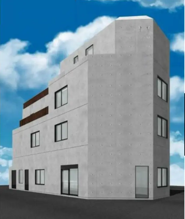 - コンクリート製のモダンな建物の外観、青空を背景にした独特な形状のデザイン