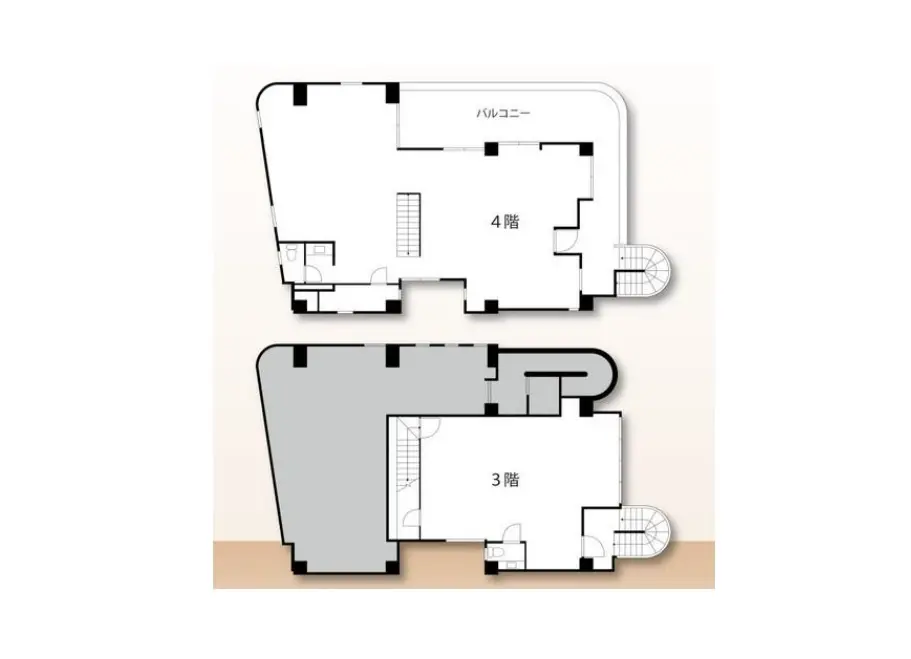 - 角地に建つ現代的な商業ビル、窓が多く明るい外観、周辺の街並みや電柱が見える風景