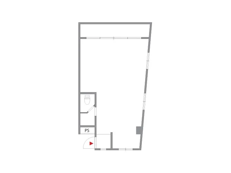 現代的なビルの外観、白い外壁に大きな窓、前に緑豊かな木、黒い車が駐車している都市風景